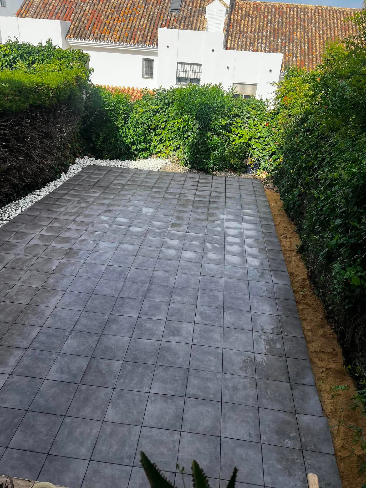 Terrace after new grey tiling